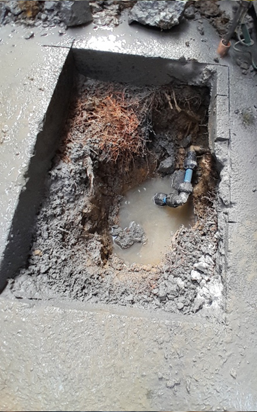 re-instatement of concrete AllGo Plumbing plumber finding water main leak in toby box at an Auckland property to check the water meter and shutoff valve